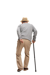 Aged man walking with a black cane