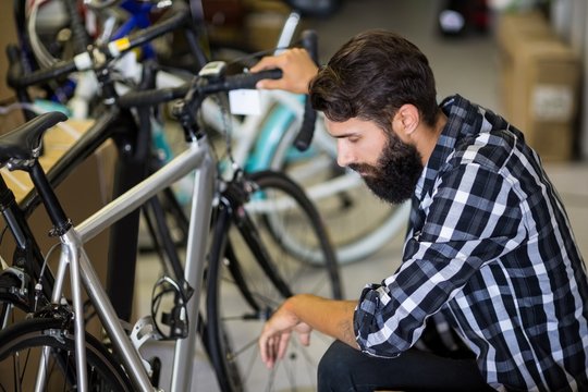Bike mechanic checking on a bicycle