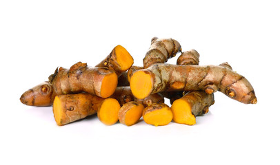 Turmeric roots on white background
