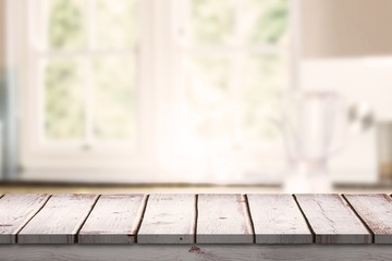 Composite image of wooden desk