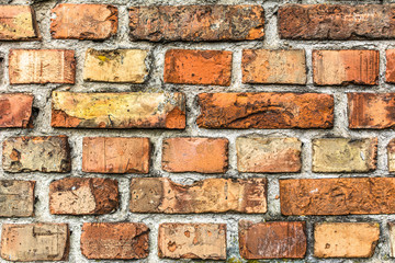 Obraz premium Old brick wall background, aged orange brick texture