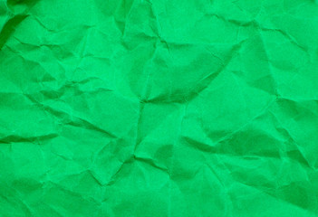 Green color crumpled paper texture background