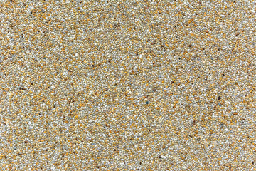 Wall of small stones texture background, natural gravel backgrou