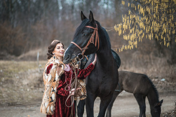Obraz premium Princess with her horse in the woods