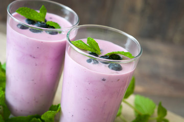 Fresh blueberry smoothie on rustic wood
