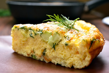 Omelette with herbs, cheese and zucchini