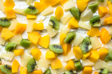 Colorful fruit background texture from fruit slices - kiwi, pine