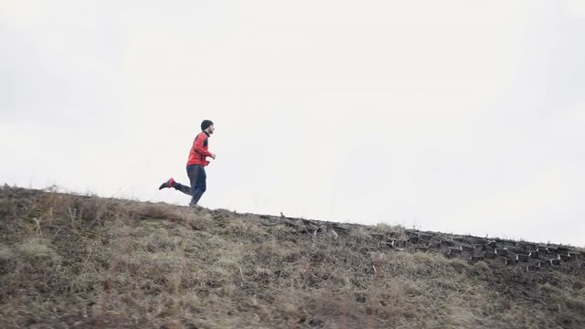 Man running in forest woods training