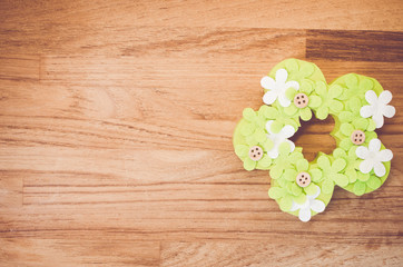 green flowers easter decoration - wood background