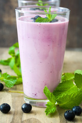 Fresh blueberry smoothie on wood
