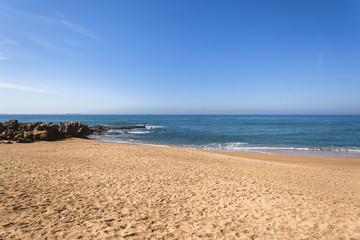 Fototapeta na wymiar Beach Blue Ocean rocks water horizon coastline