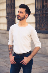 Obraz premium Portrait of a trendy young man in the city