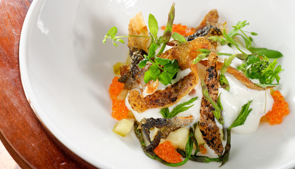 Haute cuisine, River Trout Pouched in the Wine, Under Sauce Hollandaise and caviar