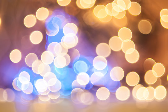 Fototapeta   Holiday dsfocused background. Abstract festive blurred lights. Holiday bokeh