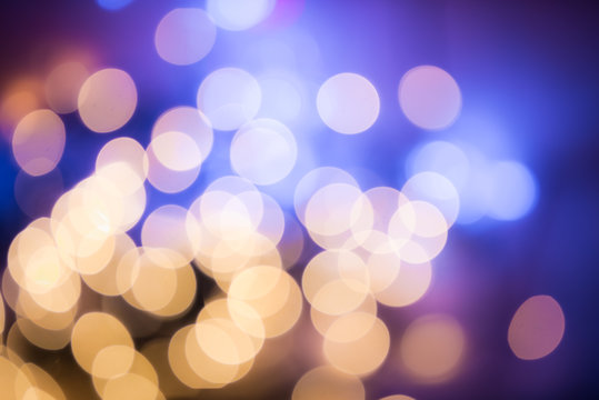Fototapeta Holiday dsfocused background. Abstract festive blurred lights. Holiday bokeh