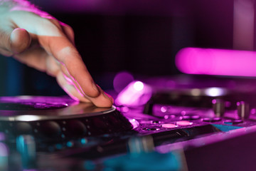 DJ Music night club, DJ technique - CD players and DJ console during the party.