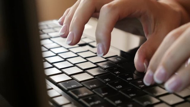 Business woman in office typing text od dark laptop keys 4K 2160p 30fps UltraHD video - Modern office and woman typing on laptop keyboard 4K 3840X2160 UHD footage 