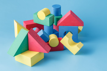 Fototapeta premium The toy castle from color blocks on blue background