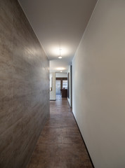 Interiors, long corridor with marble wall