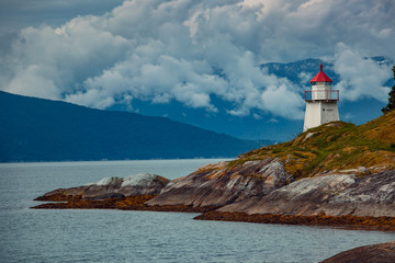 Fototapeta na wymiar Lighthouse on fjord coast