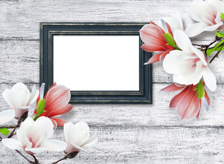 Magnolia flowers and photo frame