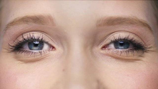 Macro of two beautiful eyes one is blinking