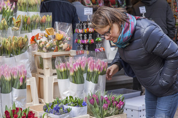 AMSTERDAM, NETHERLANDS on MARCH 27. Sale of flowers in the flower market. Bouquets of various...