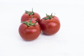 Ripe tomatoes of bright red color isolated on white