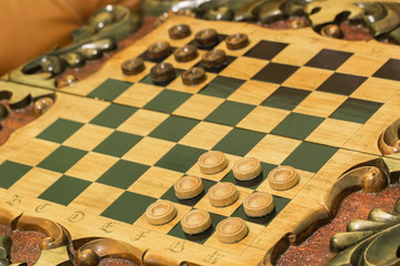 two dice and chips on the backgammon table