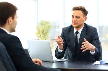 Happy business people talking on meeting at office