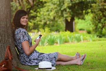 A young woman using her smart phone outdoors