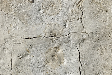 Cracks in grunge concrete wall or floor