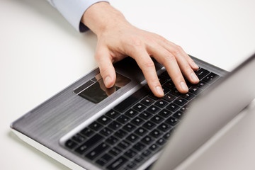 Fototapeta na wymiar close up of businessman hand typing on laptop