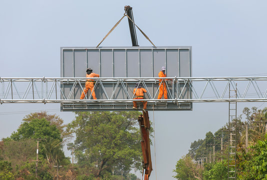 Workers Install Big Steel Billboard Over Highway