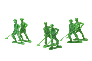 Fototapeta na wymiar a pair of green military toy soldiers