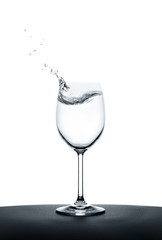 splashing water wave in the wine glass