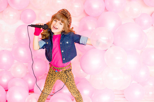 little girl with a microphone