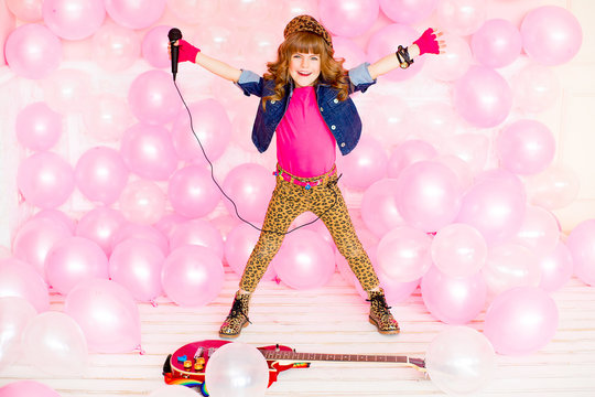 little girl with a microphone