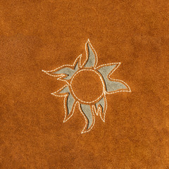 brown leather with sun design