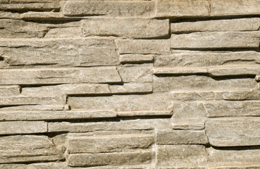 Decorative relief cladding slabs imitating stones
