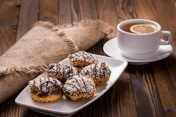 biscuits on a plate and cup of tea