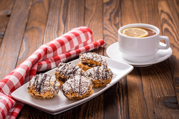 biscuits on a plate and cup of tea
