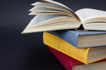 Stack of books on black background