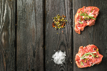 raw beef steak and spices