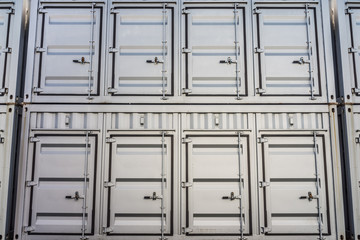 Stack of shipping containers. They are suitable to withstand shipment, storage, and handling.