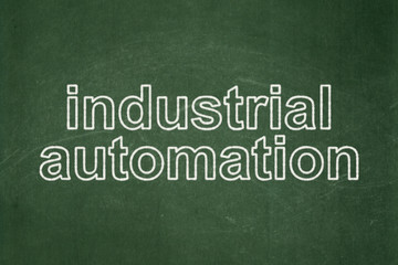 Obraz premium Manufacuring concept: Industrial Automation on chalkboard background