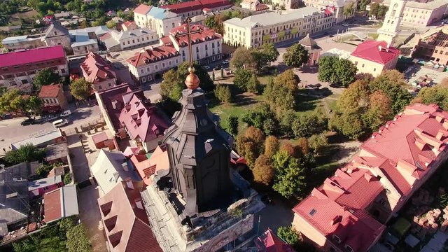 AERIAL: Rising up over European city at sunset