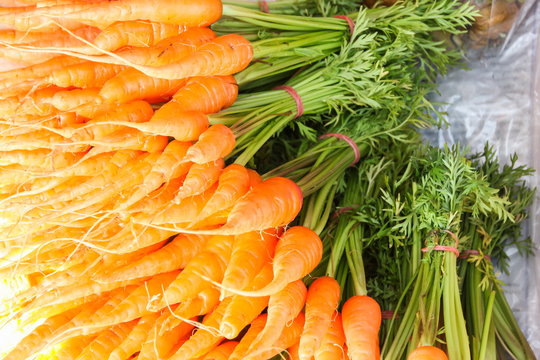 Fresh baby carrots in market.