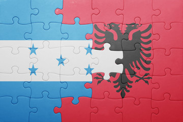 puzzle with the national flag of honduras and albania