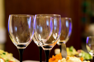 Glasses for alcoholic beverage on festive table background